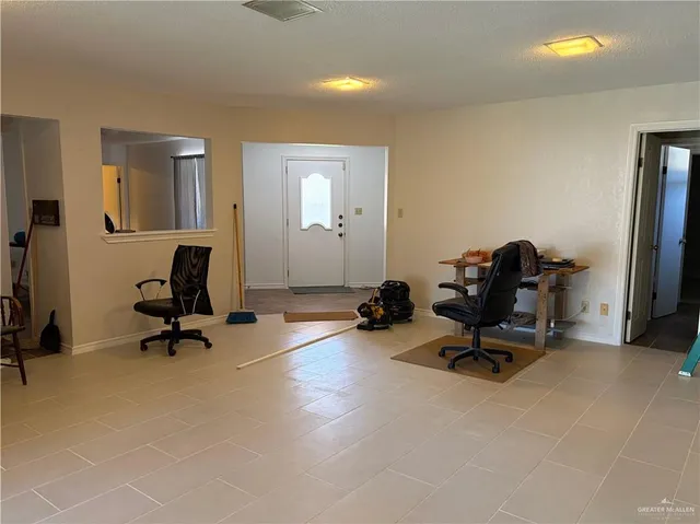 a kitchen with granite countertop wooden cabinets and white appliances