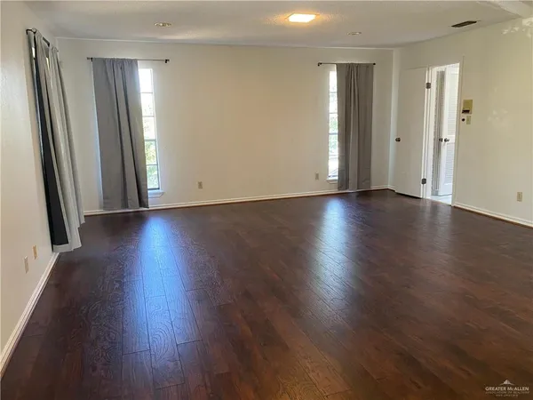 wooden floor with a glass door