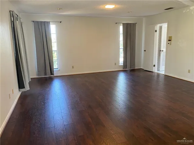 wooden floor with a glass door