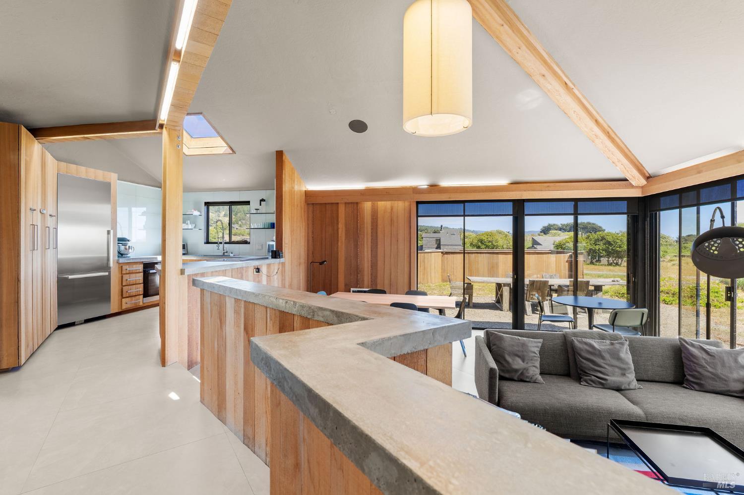 39412 Pacific Reach The Sea Ranch, CA 95497 - Photo 15 of 31 a living room filled with furniture and a large window