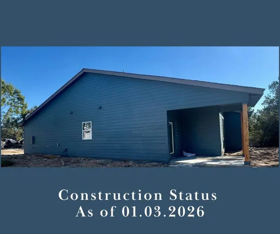 an aerial view of residential houses with outdoor space and street view