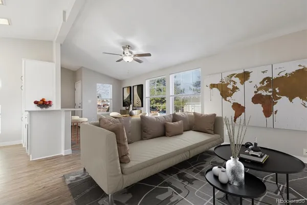a living room with furniture a rug and a chandelier