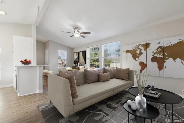 a living room with furniture a rug and a chandelier