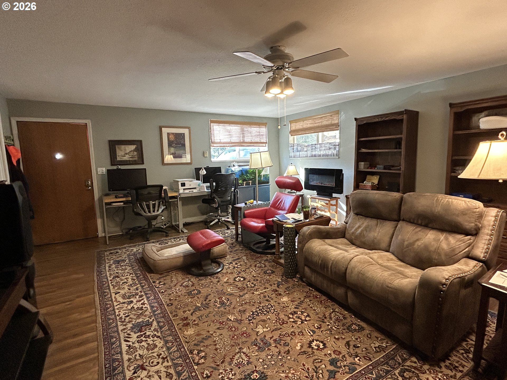 5383 Sunshine Road Roseburg, OR 97470 - Photo 18 of 47 a living room with furniture a window and a flat screen tv