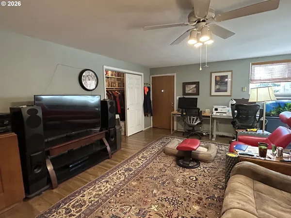 a bedroom with furniture and a chandelier