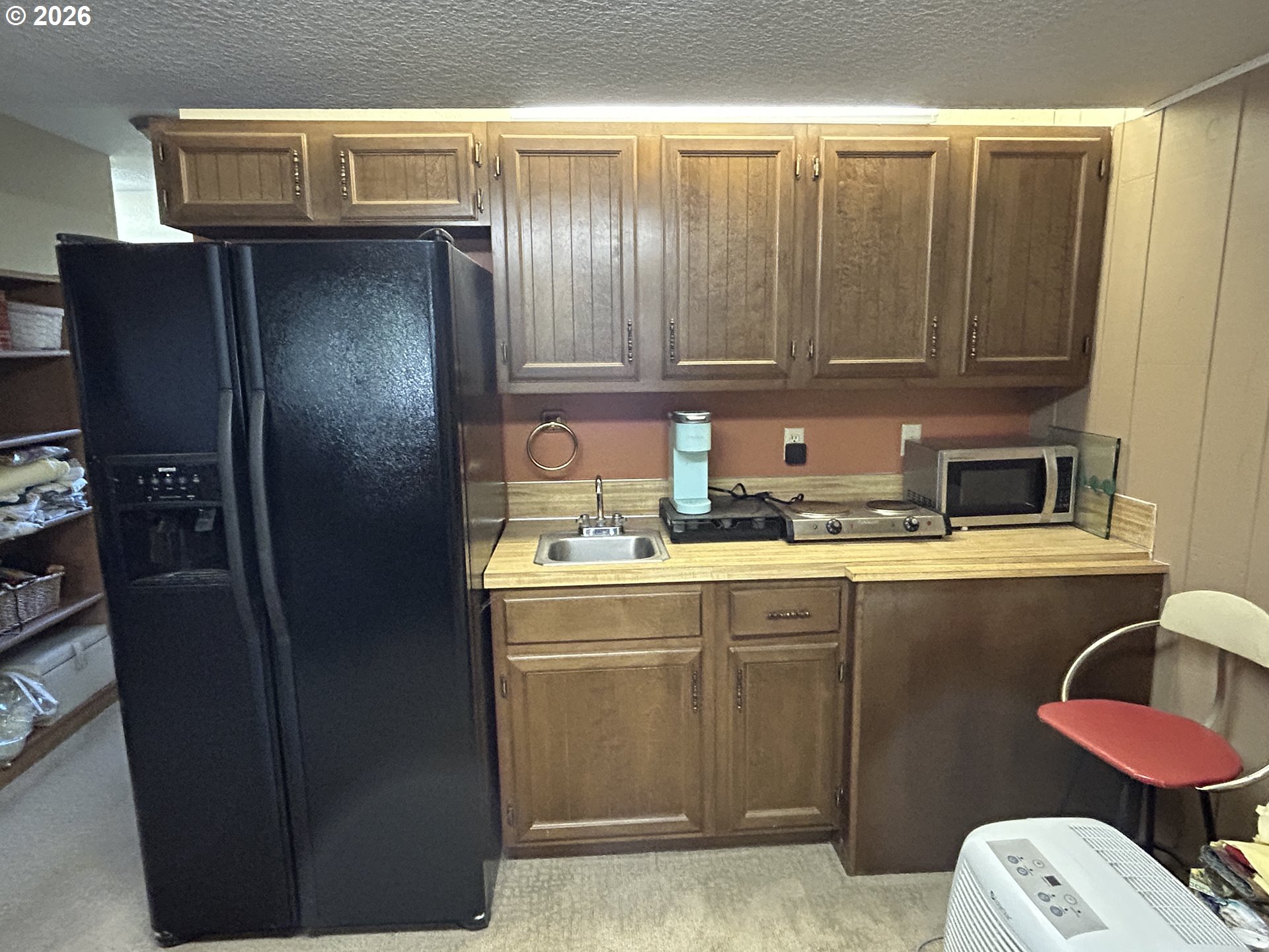 5383 Sunshine Road Roseburg, OR 97470 - Photo 28 of 47 a kitchen with a refrigerator and sink