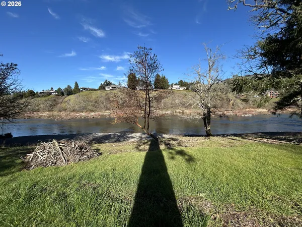 a view of a lake in front of the house