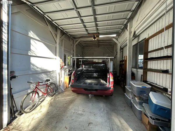 a view of parking garage with cars
