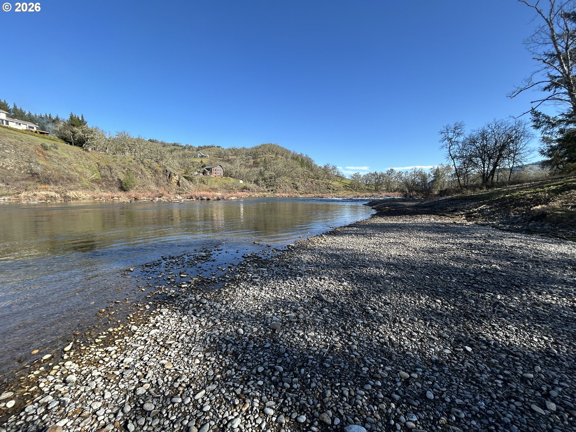 5383 Sunshine Road Roseburg, OR 97470 - Photo 4 of 47 a view of a lake with a mountain in the background