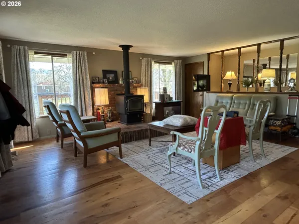 a living room with furniture and large windows