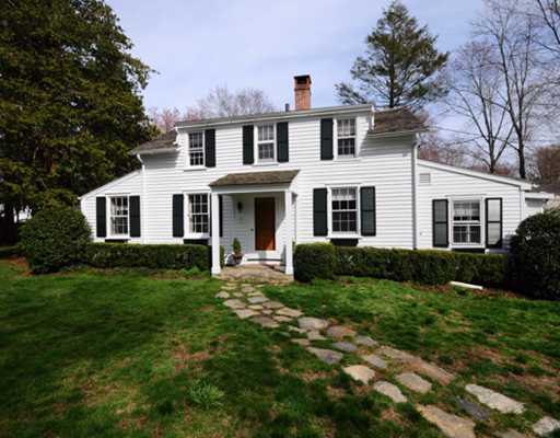 334 Hollow Tree Ridge Road Darien, CT 06820 - Photo 1 of 20 a front view of a house with a yard