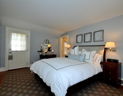 334 Hollow Tree Ridge Road Darien, CT 06820 - Photo 12 of 20 a bedroom with a bed and window