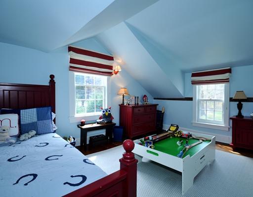 334 Hollow Tree Ridge Road Darien, CT 06820 - Photo 17 of 20 a bedroom with furniture and a window