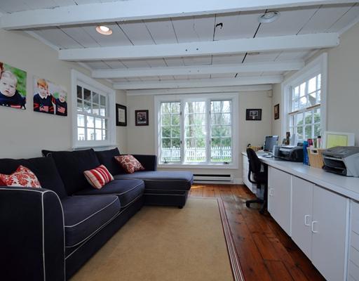 334 Hollow Tree Ridge Road Darien, CT 06820 - Photo 18 of 20 a living room with furniture and a large window