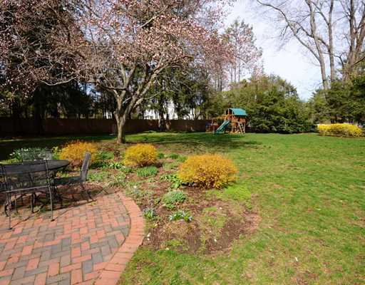 334 Hollow Tree Ridge Road Darien, CT 06820 - Photo 20 of 20 a view of a garden with lawn chairs