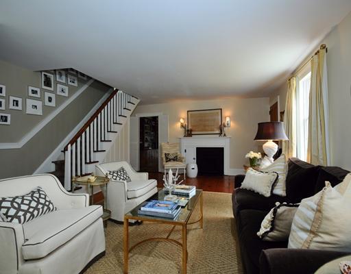 334 Hollow Tree Ridge Road Darien, CT 06820 - Photo 4 of 20 a living room with furniture fireplace and a large window