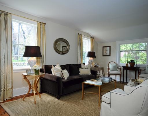 334 Hollow Tree Ridge Road Darien, CT 06820 - Photo 5 of 20 a living room with furniture a clock on wall and a window