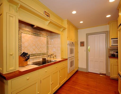 334 Hollow Tree Ridge Road Darien, CT 06820 - Photo 7 of 20 a kitchen with stainless steel appliances a sink and cabinets