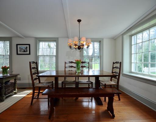 334 Hollow Tree Ridge Road Darien, CT 06820 - Photo 8 of 20 a view of a dining room with furniture window and wooden floor