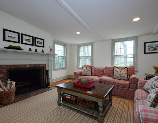 334 Hollow Tree Ridge Road Darien, CT 06820 - Photo 9 of 20 a living room with furniture a window and a fireplace