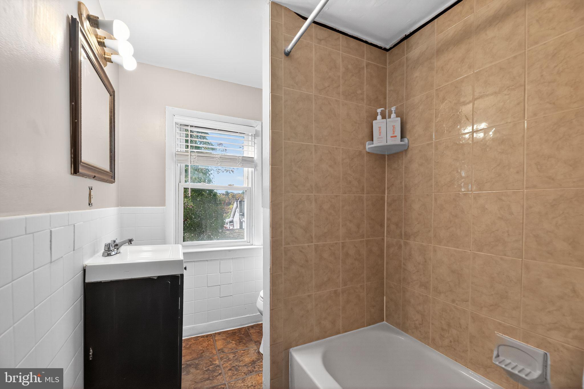 1138 Fourth Avenue Croydon, PA 19021 - Photo 11 of 15 a bathroom with a sink a toilet and shower