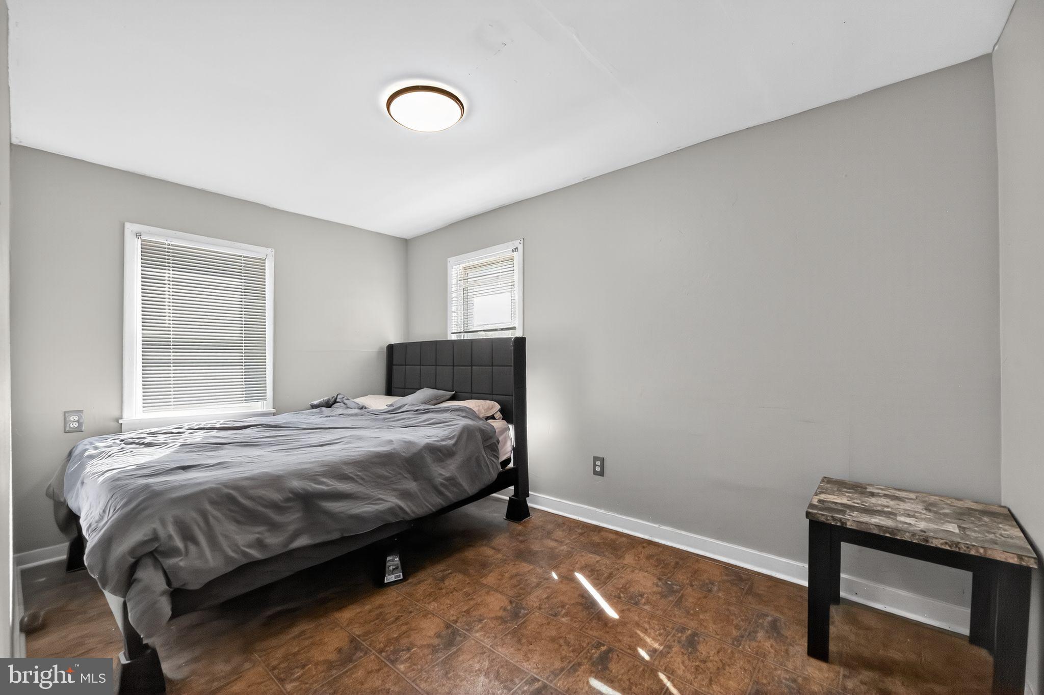 1138 Fourth Avenue Croydon, PA 19021 - Photo 12 of 15 a bedroom with a bed and a window