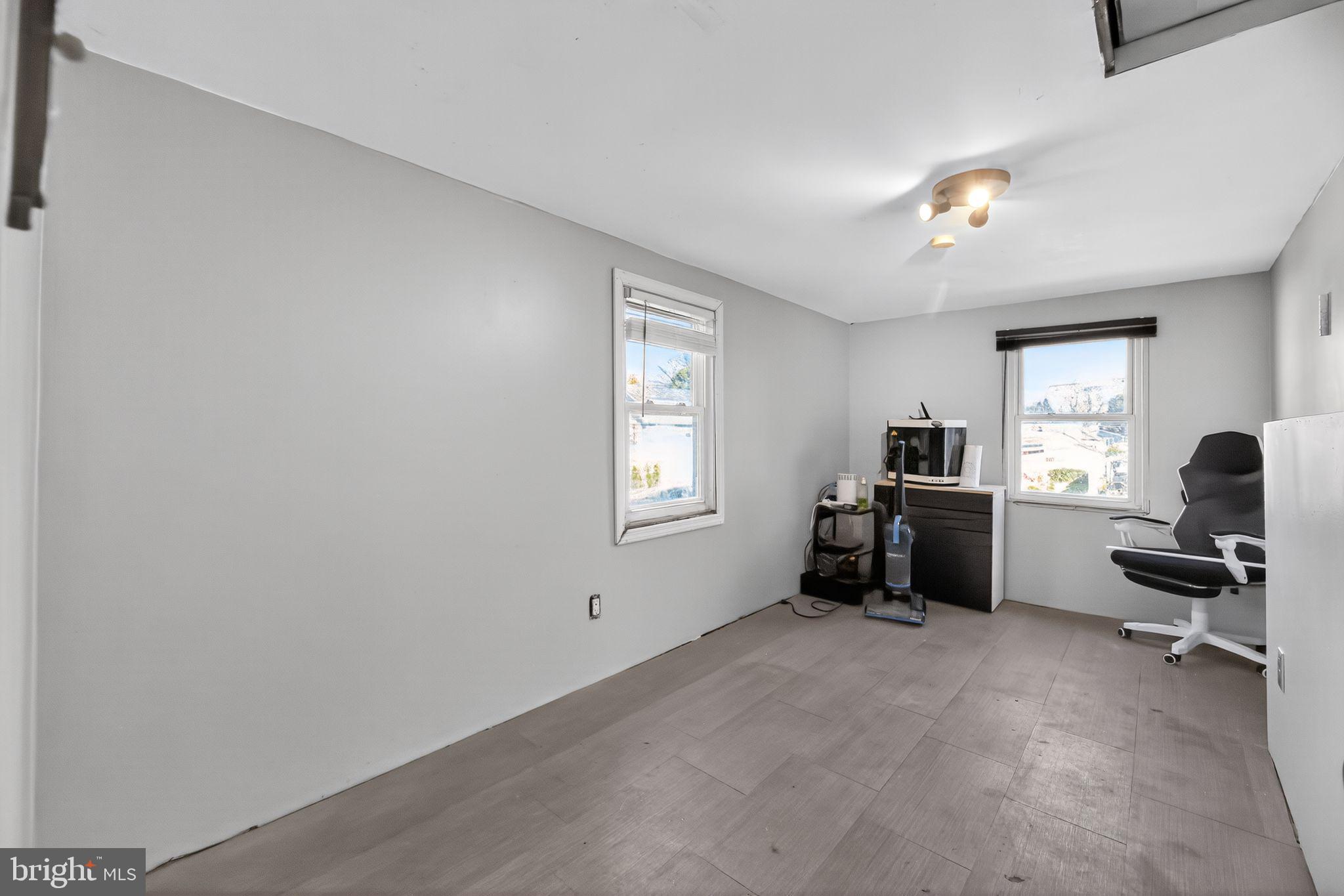 1138 Fourth Avenue Croydon, PA 19021 - Photo 13 of 15 a view of a workspace with furniture and a window