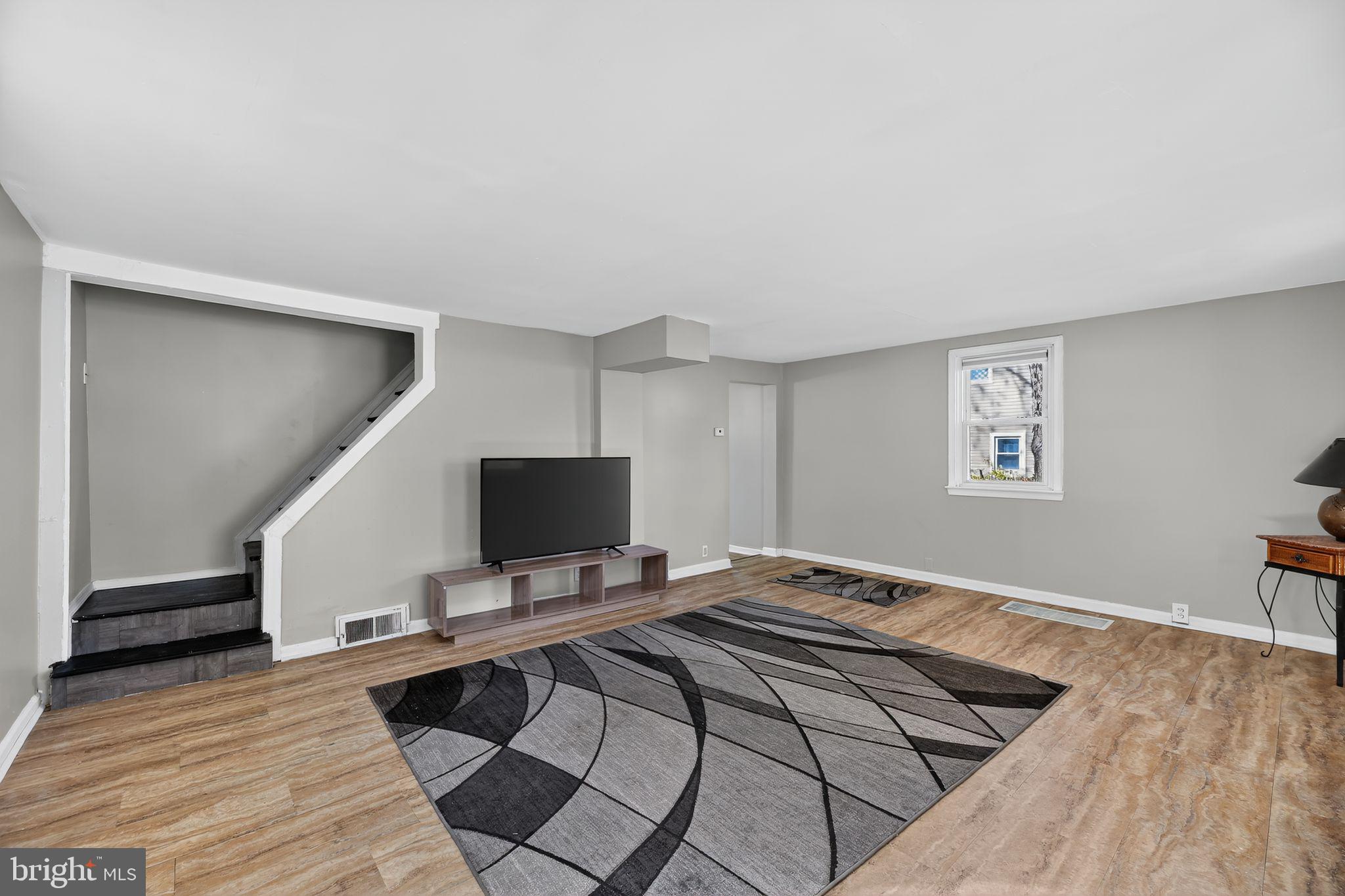 1138 Fourth Avenue Croydon, PA 19021 - Photo 4 of 15 a bedroom with a bed and a flat screen tv