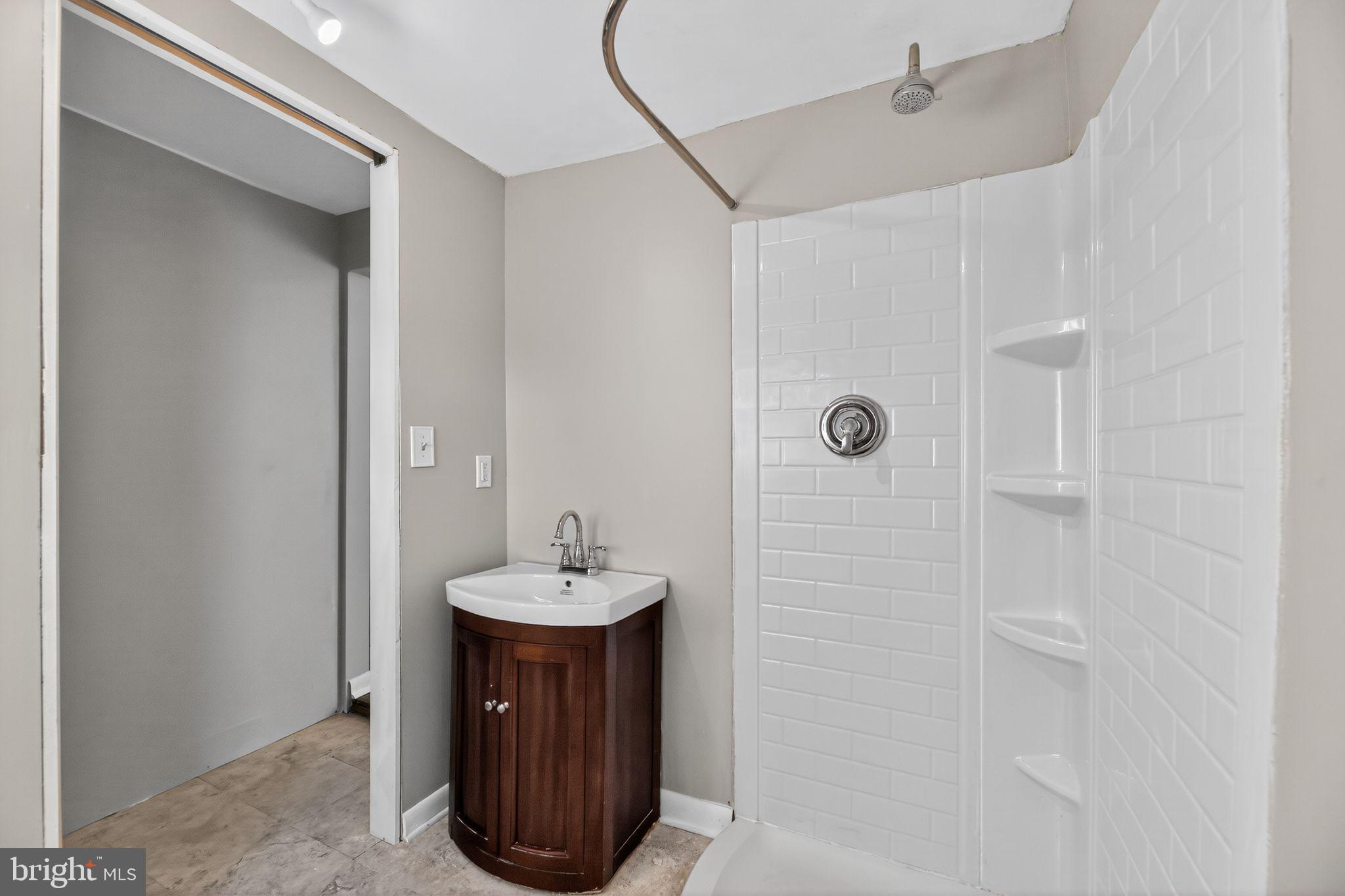 1138 Fourth Avenue Croydon, PA 19021 - Photo 8 of 15 a bathroom with a sink a toilet and shower
