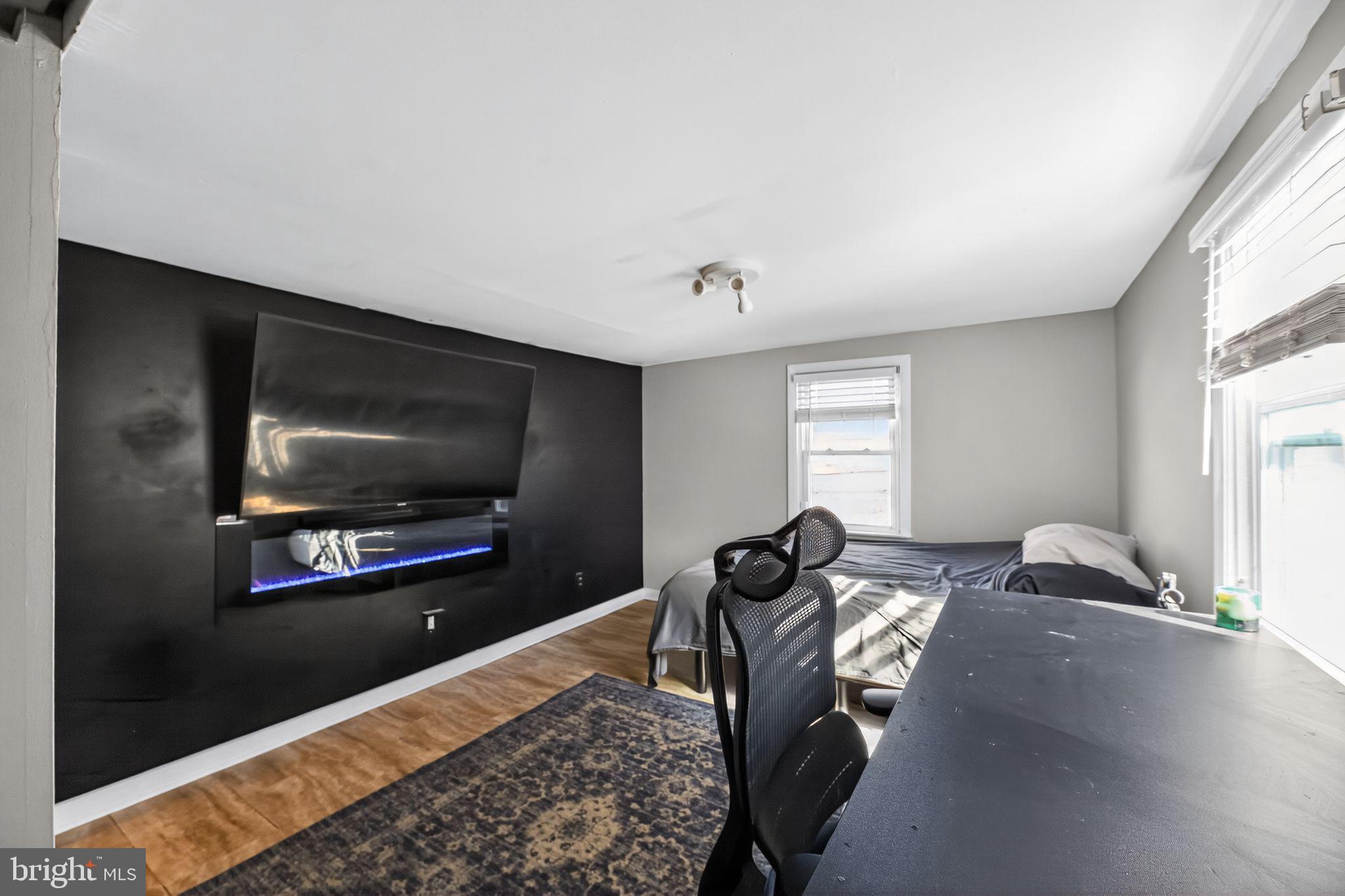 1138 Fourth Avenue Croydon, PA 19021 - Photo 9 of 15 a living room with furniture and a flat screen tv