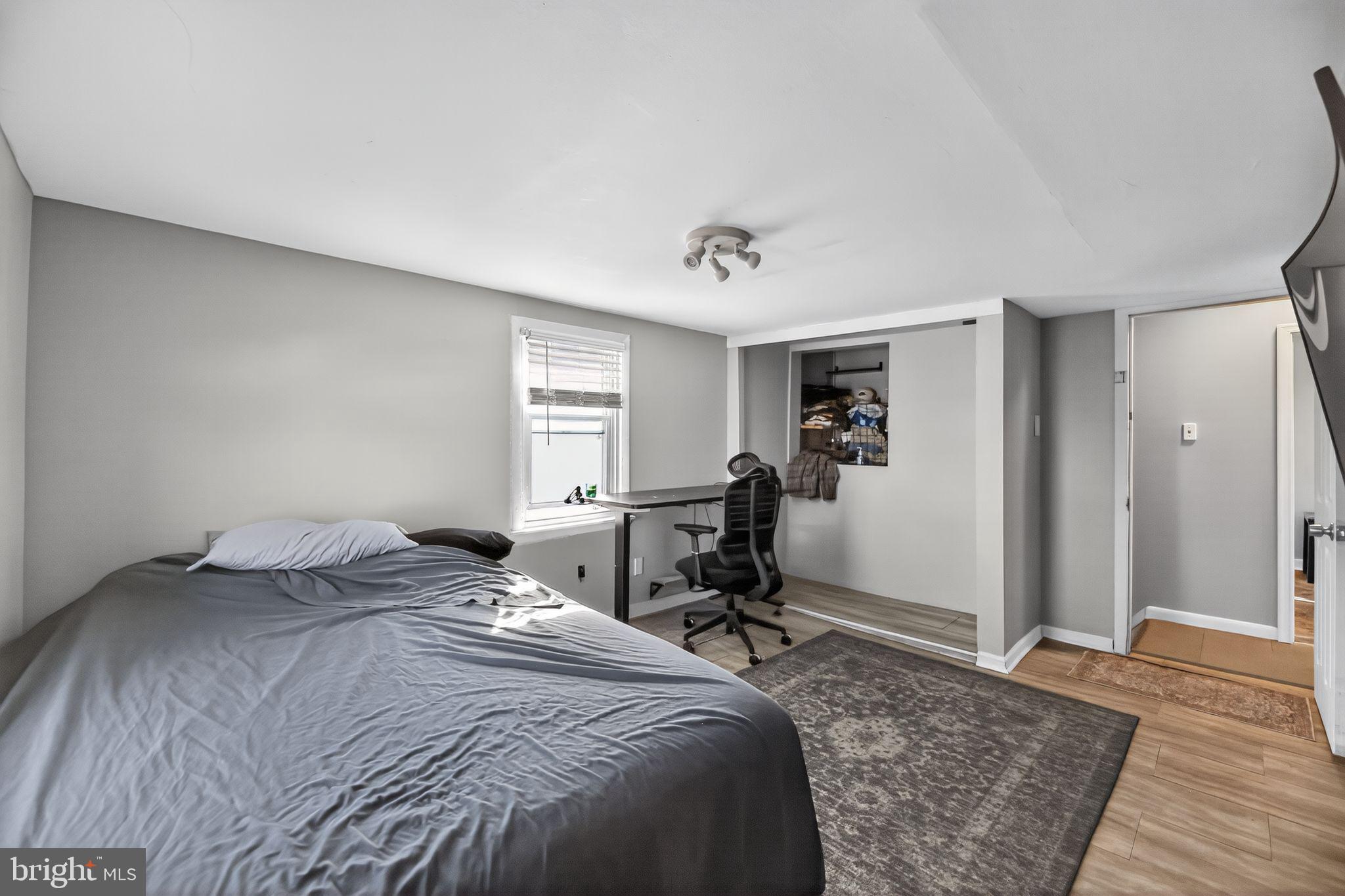 1138 Fourth Avenue Croydon, PA 19021 - Photo 10 of 15 a bedroom with a bed and wooden floor