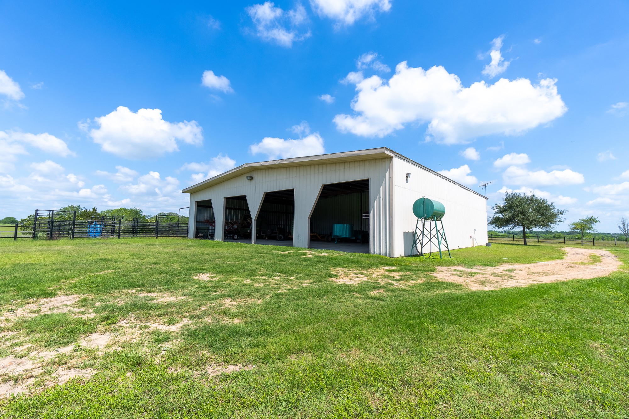 5018 Wolters Road Schulenburg, TX 78956 - Photo 12 of 39 a view of a backyard with plants and a garden
