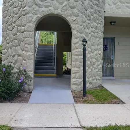 a view of a kitchen with furniture and windows