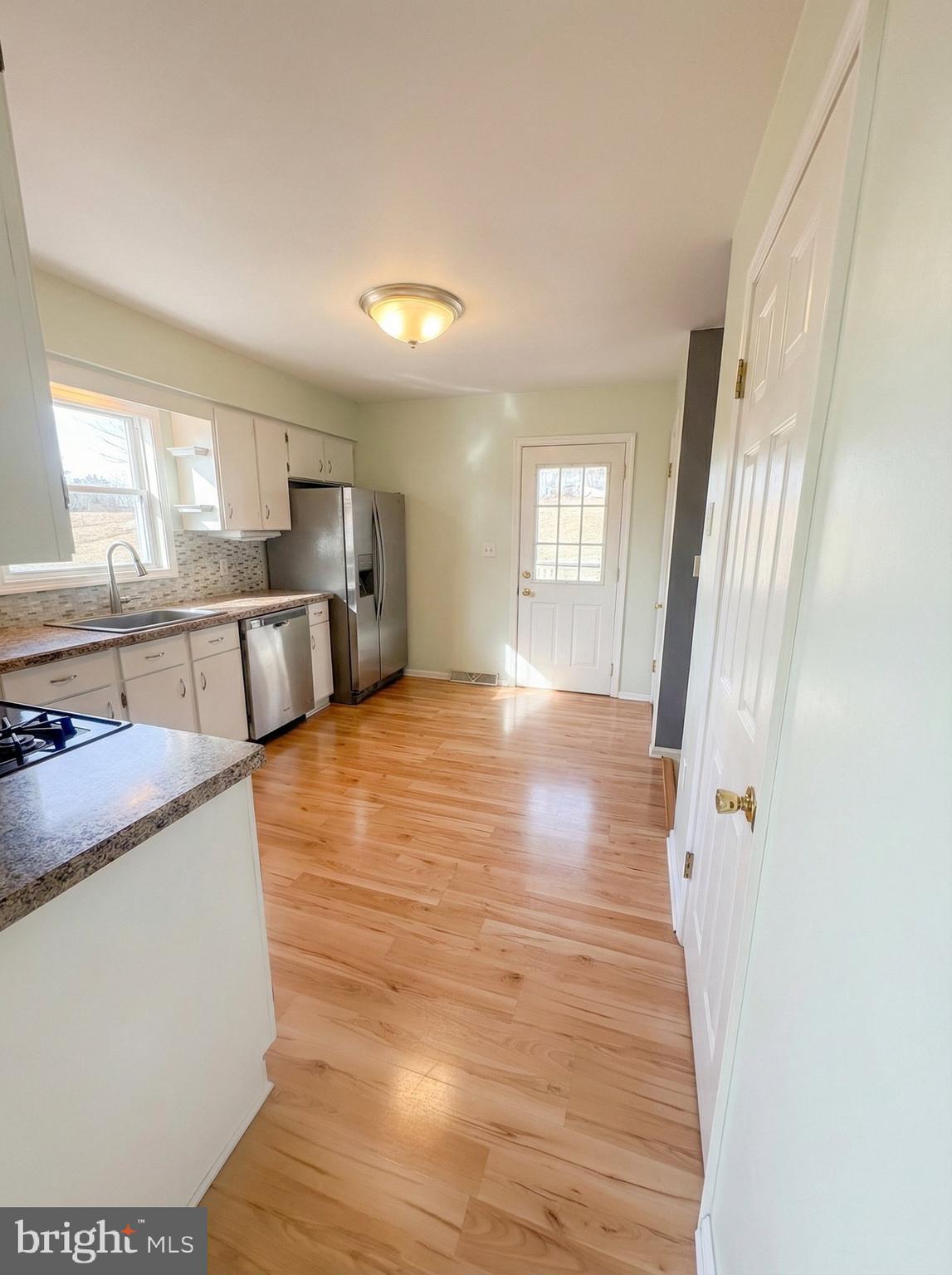 970 Haines Road York, PA 17402 - Photo 9 of 20 a view of a kitchen with wooden floor and electronic appliances