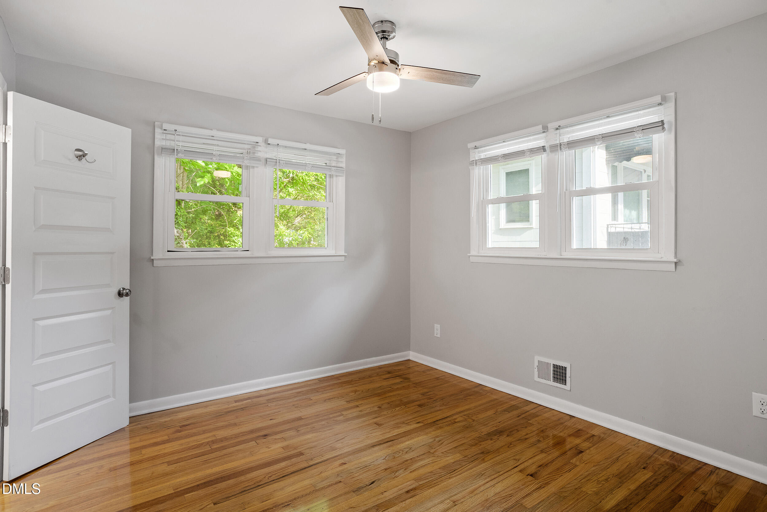 2414 Chapin Street Durham, NC 27707 - Photo 20 of 30 a view of empty room with wooden floor and fan