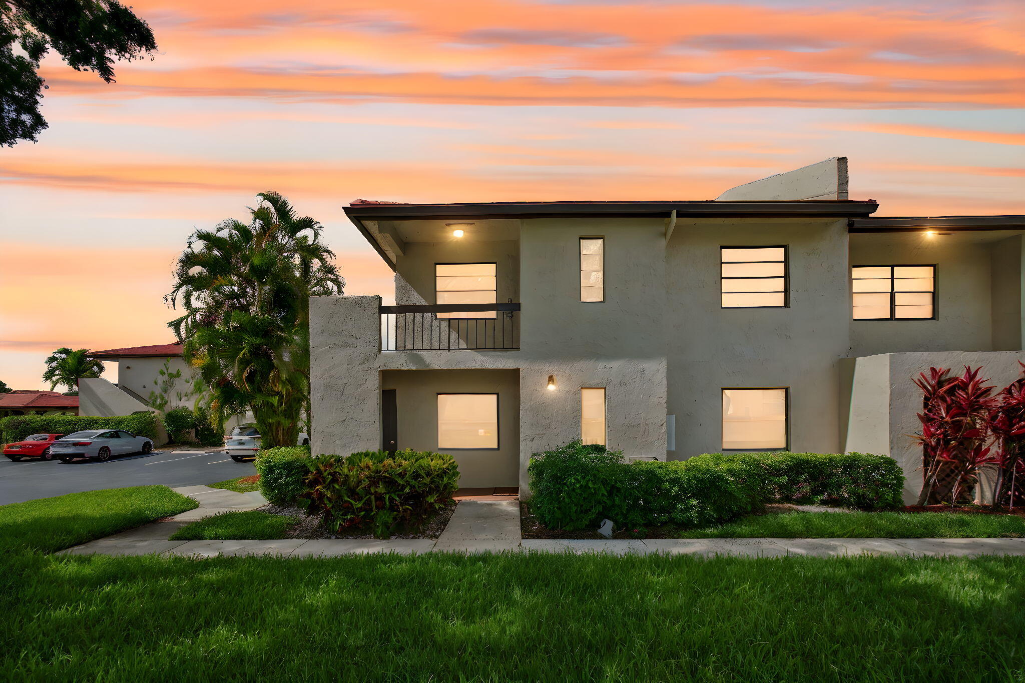 8536 Casa Del Lago, Unit 49B Boca Raton, FL 33433 - Photo 77 of 79 a front view of a house with a yard