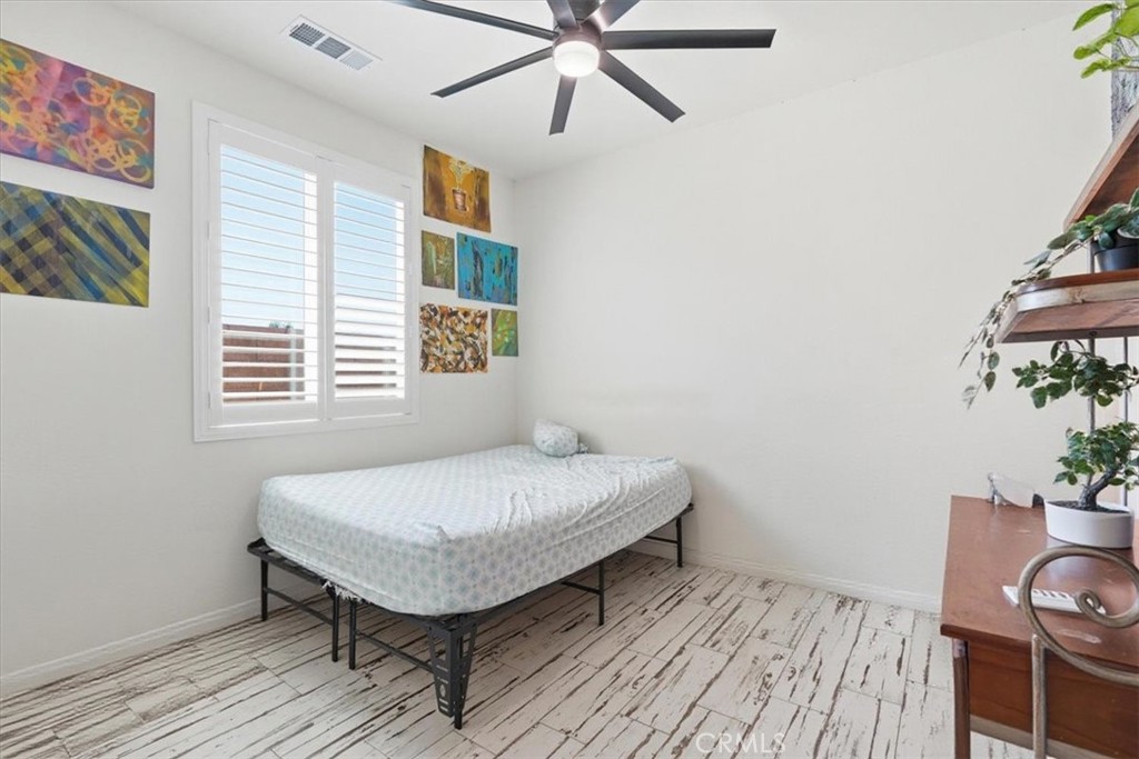 32350 Iron Trail Road Winchester, CA 92596 - Photo 26 of 32 a bedroom with a bed and a table