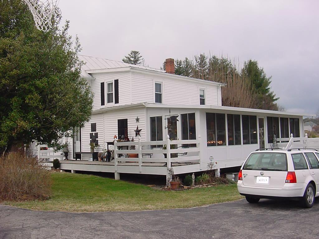 367 Conner Grove Road Southwest Willis, VA 24380 - Photo 2 of 22 a front view of a house with a garden