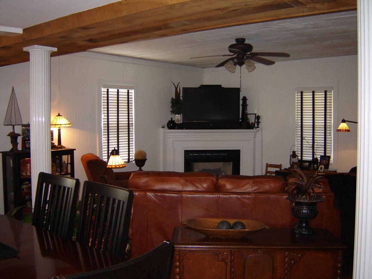367 Conner Grove Road Southwest Willis, VA 24380 - Photo 16 of 22 a living room with furniture a flat screen tv and a fireplace