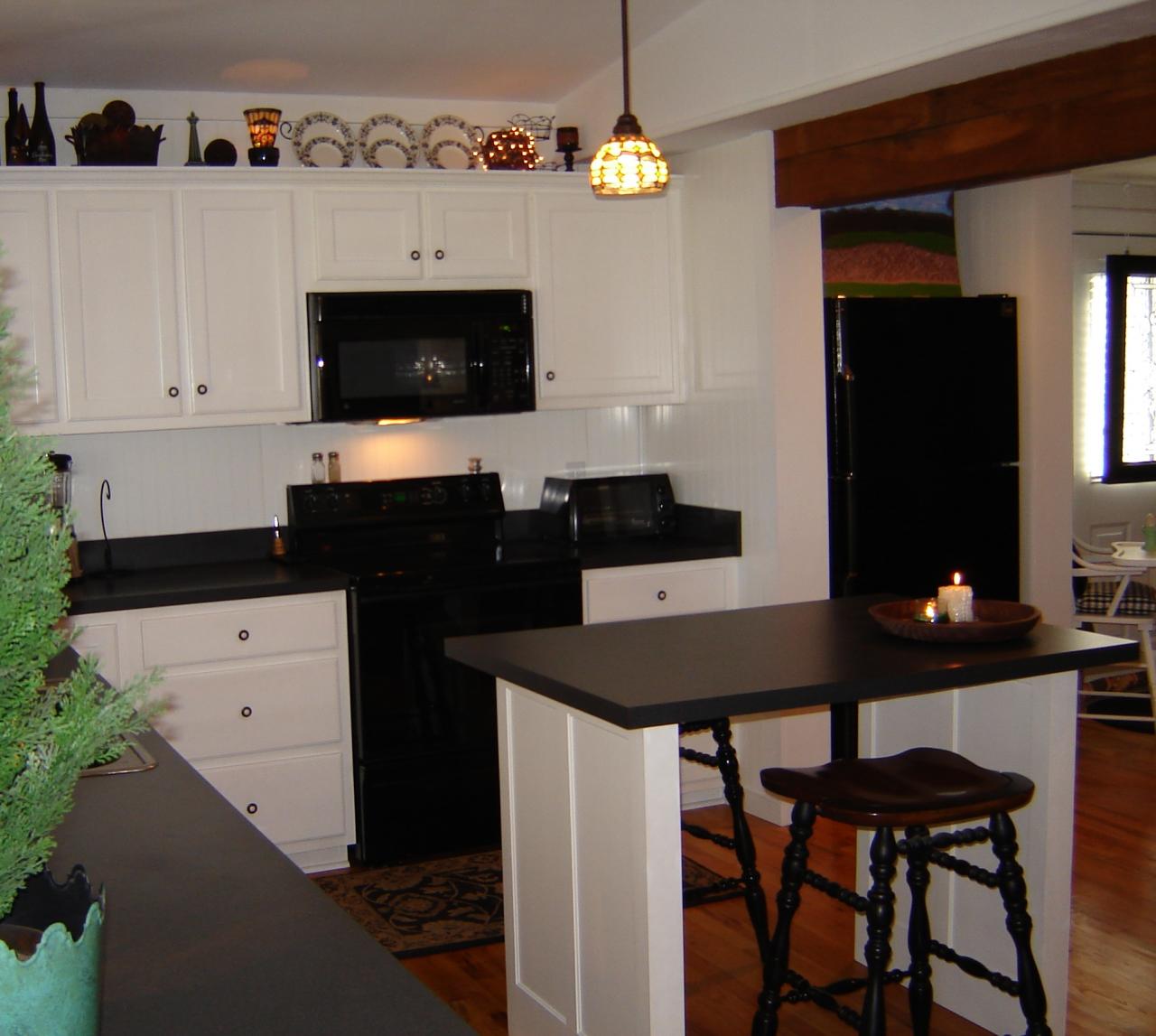 367 Conner Grove Road Southwest Willis, VA 24380 - Photo 19 of 22 a kitchen with a sink cabinets and wooden floor