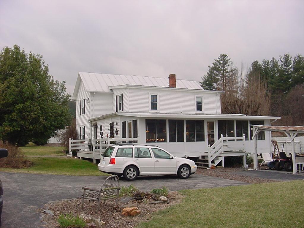 367 Conner Grove Road Southwest Willis, VA 24380 - Photo 5 of 22 a car parked in front of a house