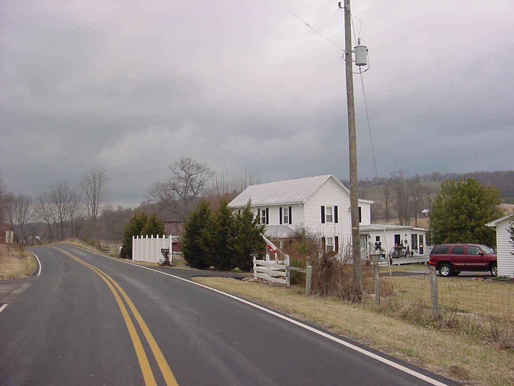 367 Conner Grove Road Southwest Willis, VA 24380 - Photo 6 of 22 a view of a city street and a cars parked on the roadside
