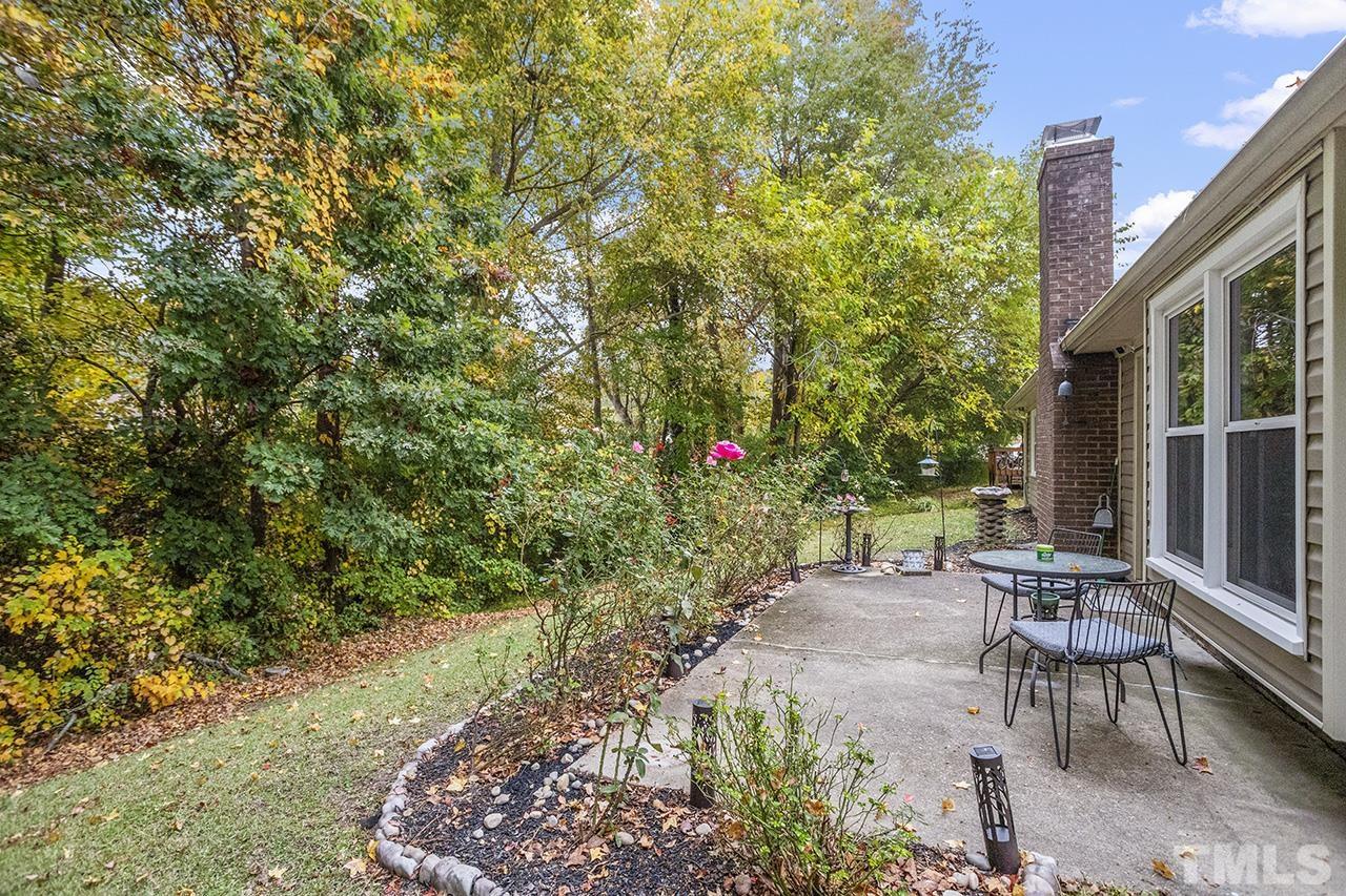 4604 Fox Road Raleigh, NC 27616 - Photo 8 of 29 a view of a patio with table and chairs and potted plants