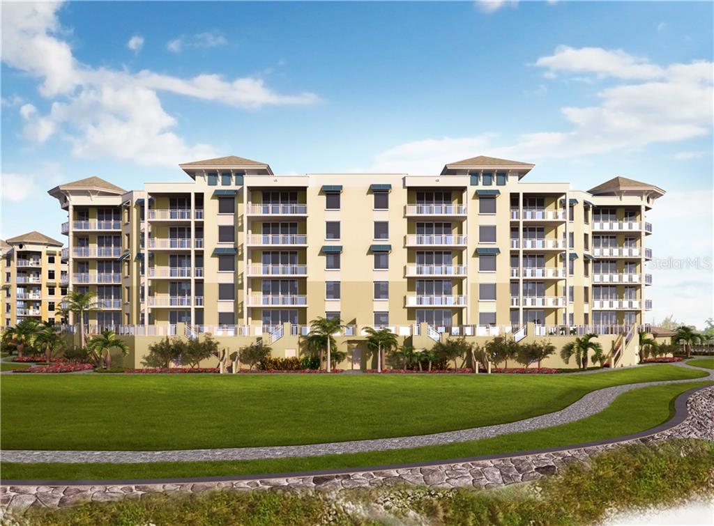 795 Collany Road, Unit 406 Tierra Verde, FL 33715 - Photo 1 of 1 a front view of a building with a garden