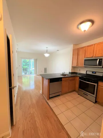 a view of a kitchen from the hallway