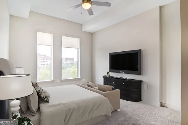 a bedroom with bed and window