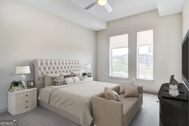 a bathroom with a double vanity sink a toilet and shower