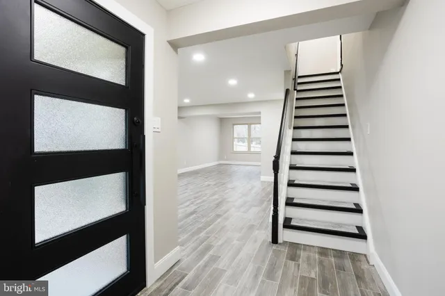a view of entryway with wooden floor