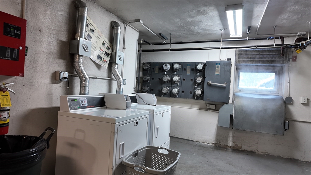 99 Cluff Crossing Road, Unit E9 Salem, NH 03079 - Photo 12 of 13 a kitchen with a sink and cabinets