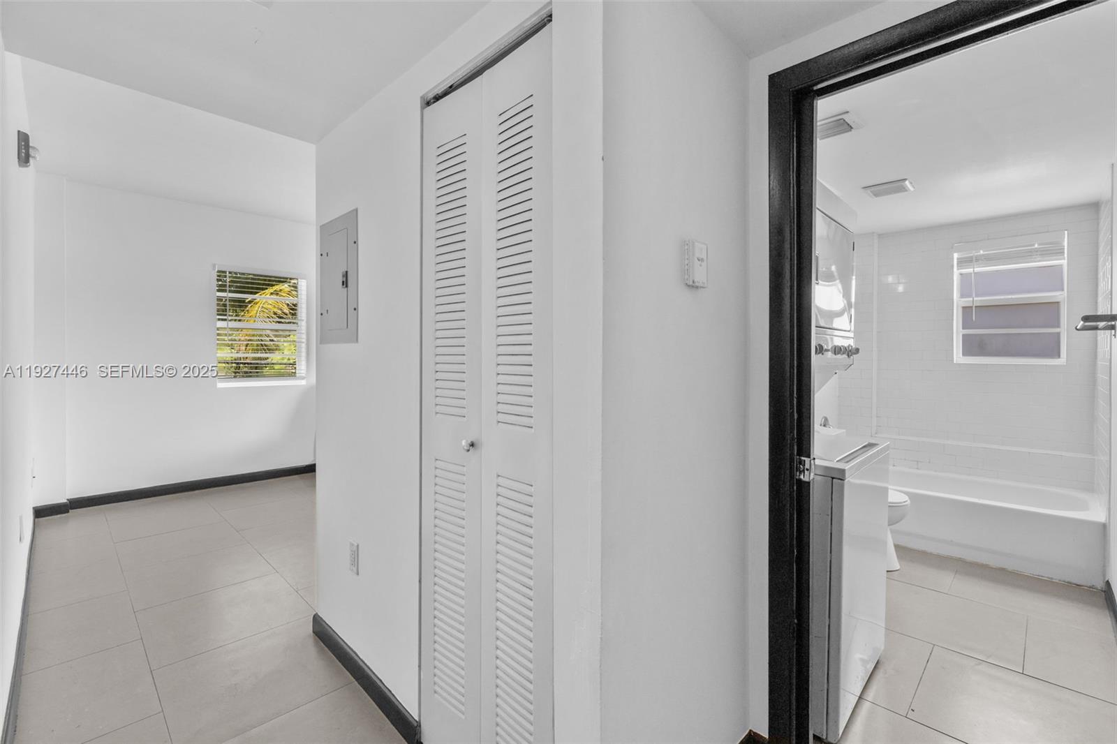1876 Southwest 11th Terrace, Unit 206 Miami, FL 33135 - Photo 12 of 15 a view of a hallway with front door